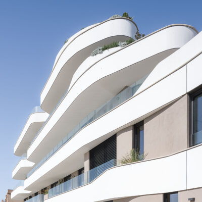 Upward view of the curved balconies of the ONE Ibiza.