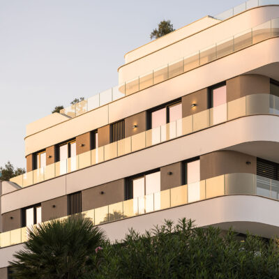Side facade of the ONE Ibiza in the evening sunlight.