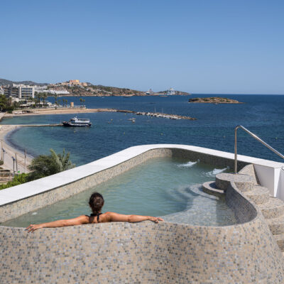Rooftop pool of the ONE Ibiza overlooking Ibiza bay.